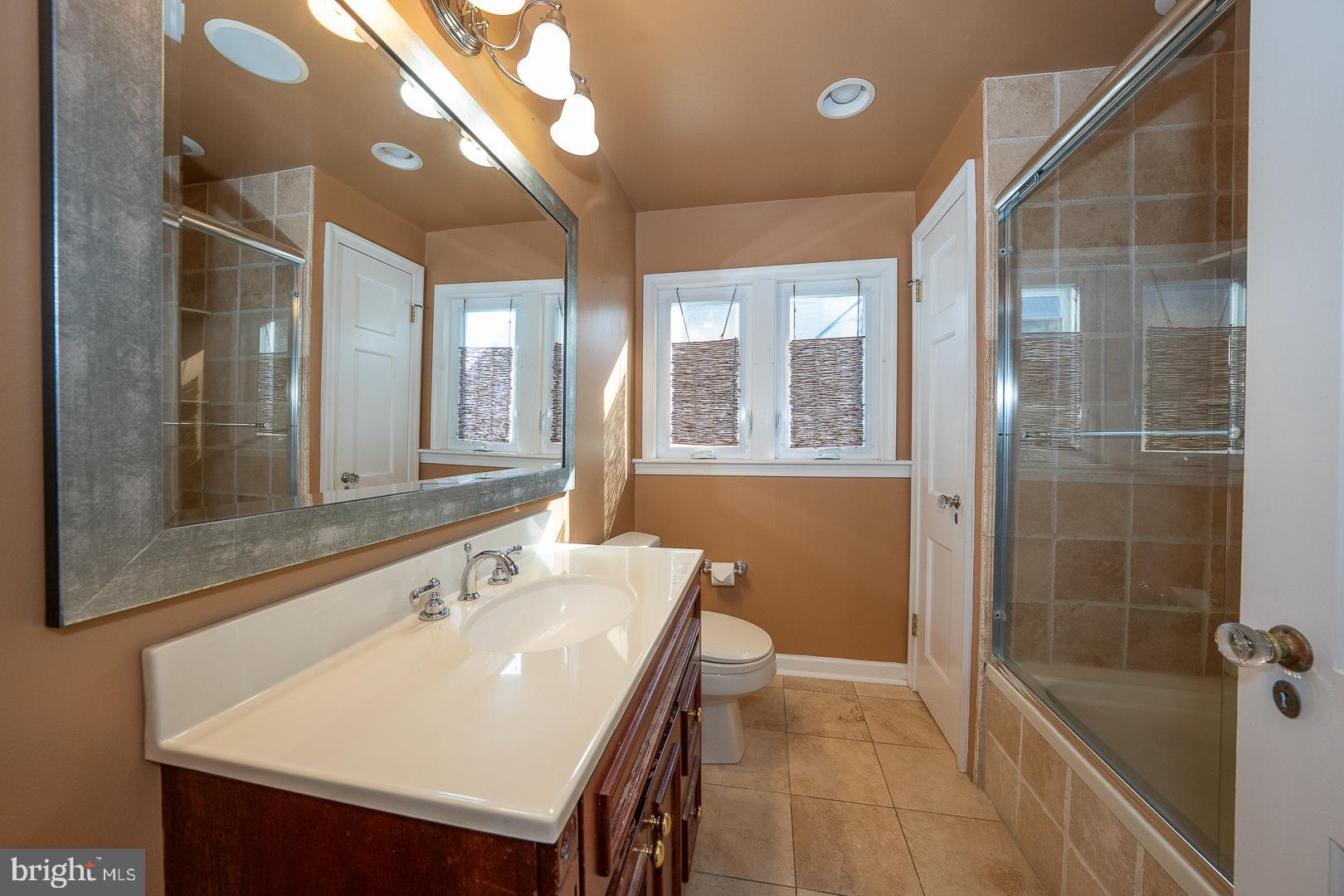 2939 Berkley Road Ardmore, PA 19003 - Photo 20 of 37 a bathroom with a sink a toilet and shower