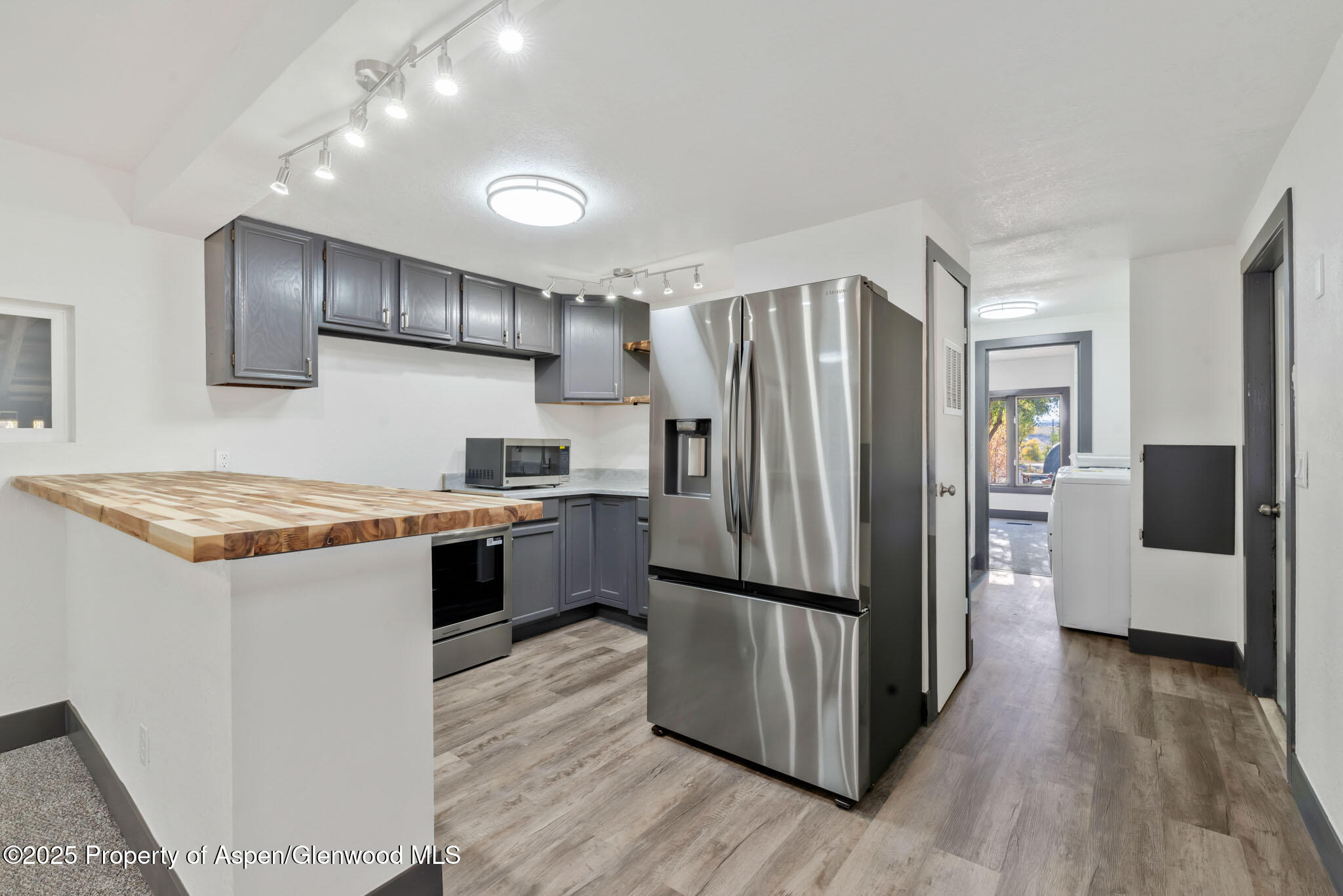 295 South Spruce Street Hayden, CO 81639 - Photo 11 of 40 a kitchen with a refrigerator and a sink