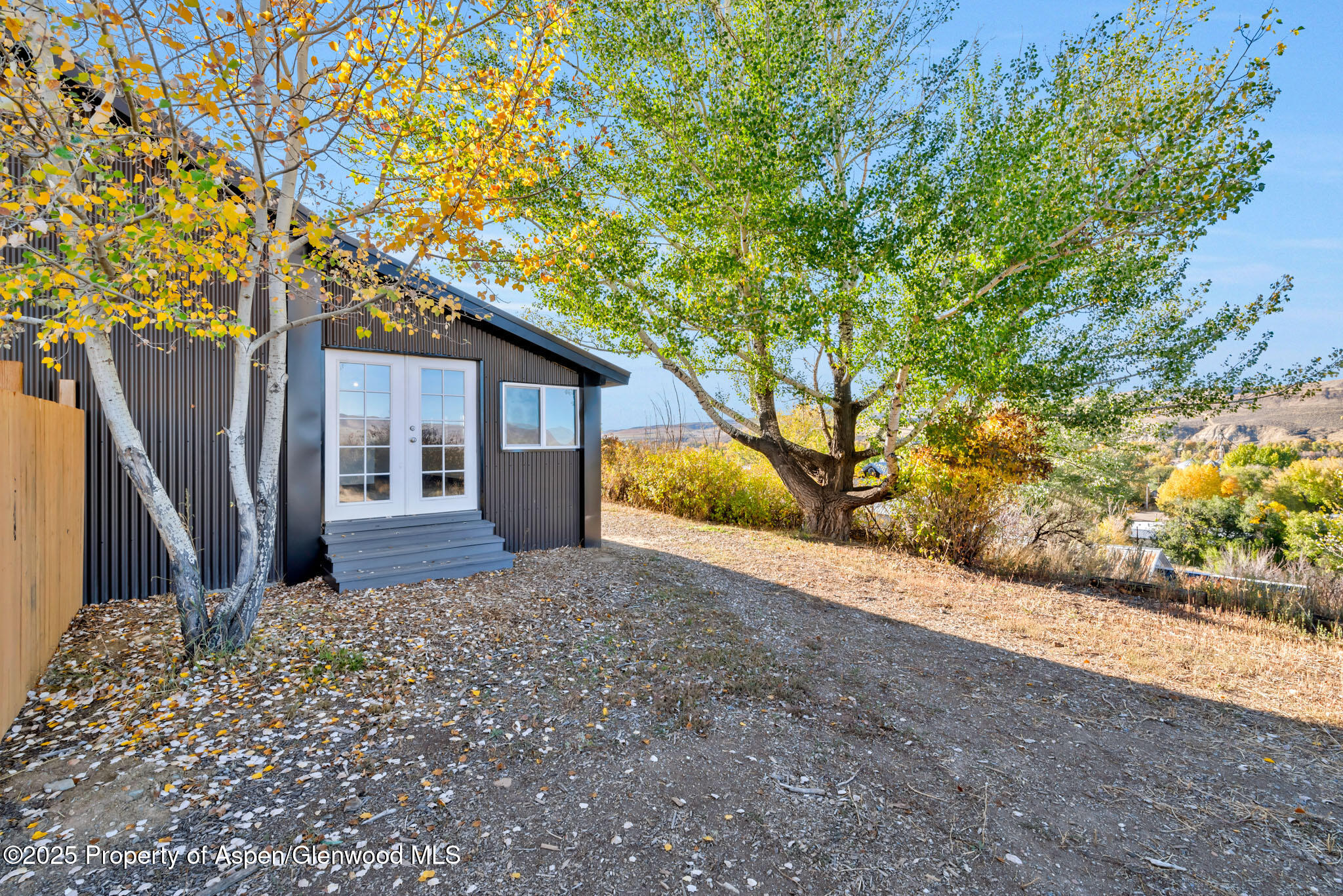295 South Spruce Street Hayden, CO 81639 - Photo 36 of 40 a front view of a house with a yard and garage