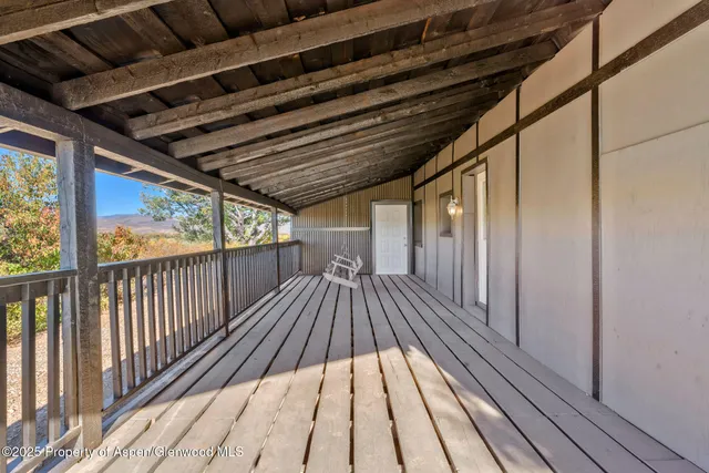 a view of balcony with wooden floor