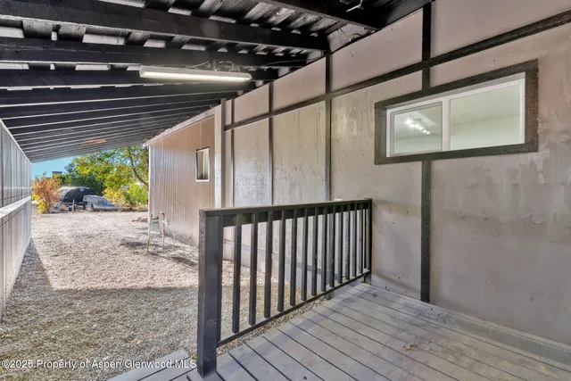 a view of porch with wooden floor