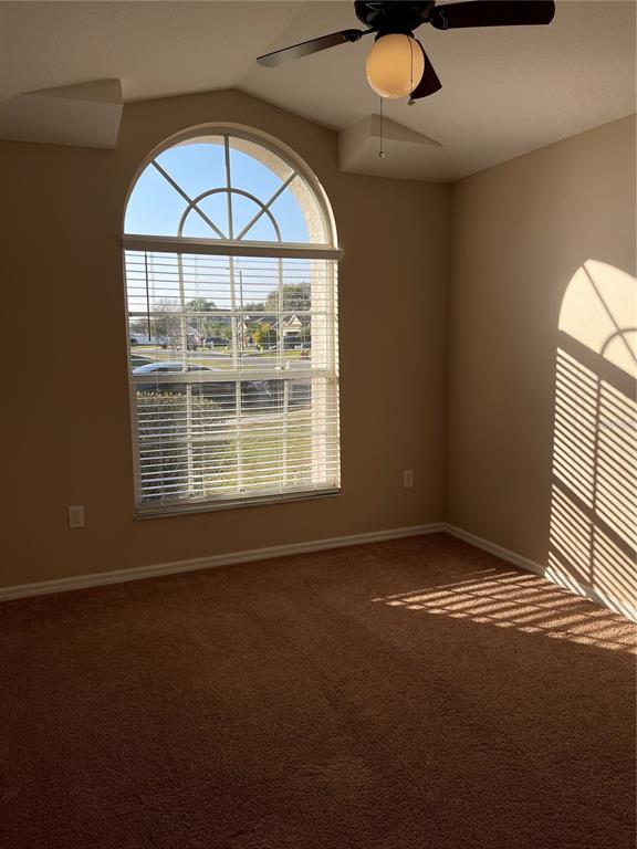 1930 Grenville Court Wesley Chapel, FL 33543 - Photo 13 of 18 an empty room with a window