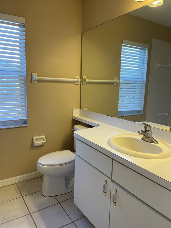 1930 Grenville Court Wesley Chapel, FL 33543 - Photo 15 of 18 a bathroom with a sink and a toilet