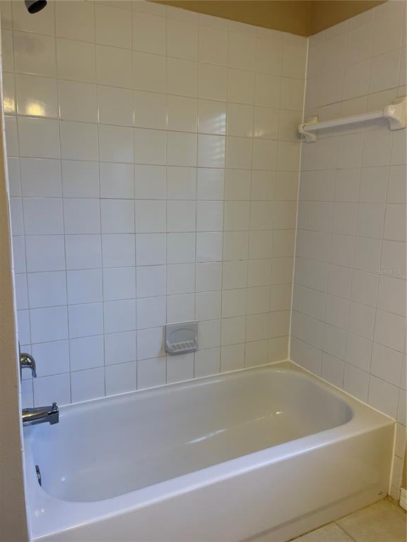 1930 Grenville Court Wesley Chapel, FL 33543 - Photo 16 of 18 a bathroom with a bathtub