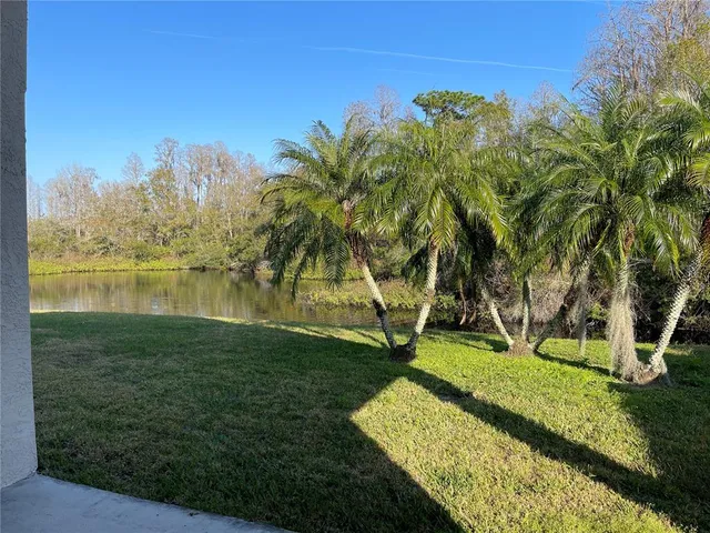 a view of a garden with a house