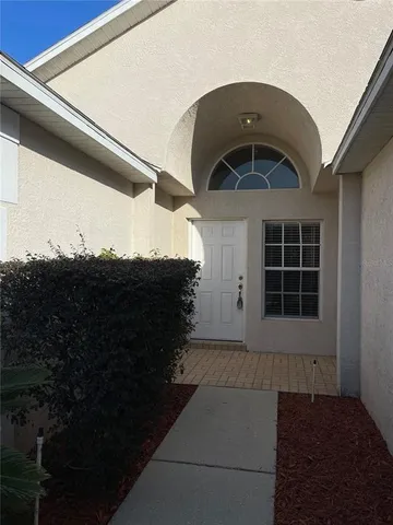 a front view of a house with a garage