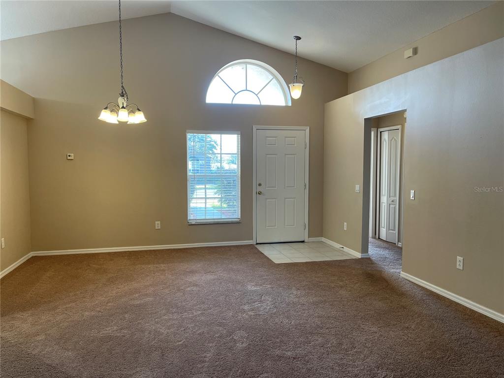 1930 Grenville Court Wesley Chapel, FL 33543 - Photo 4 of 18 an empty room that has a window in it