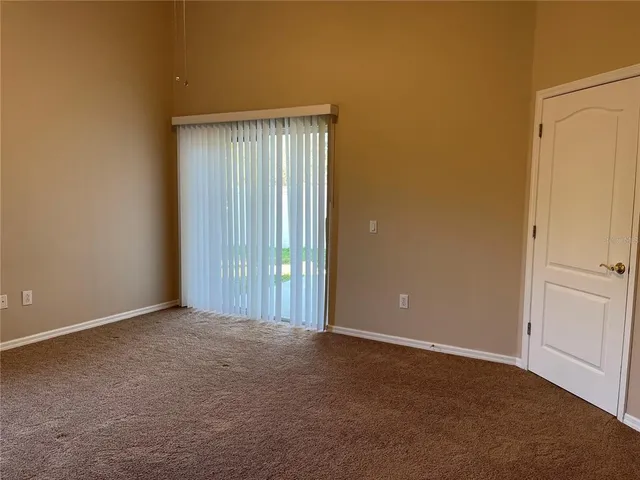 an empty room with closet area