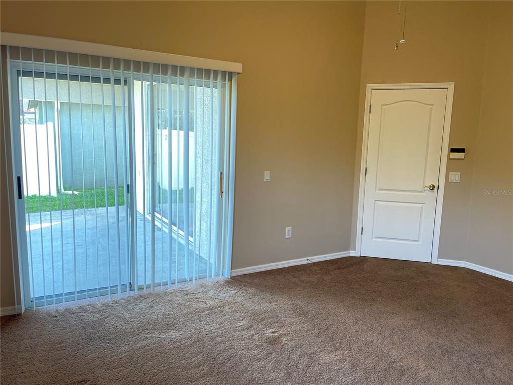 1930 Grenville Court Wesley Chapel, FL 33543 - Photo 9 of 18 an empty room with windows