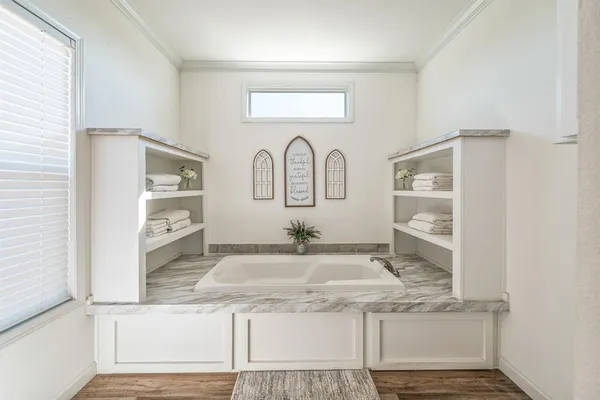 a view of kitchen with granite countertop stove and cabinets