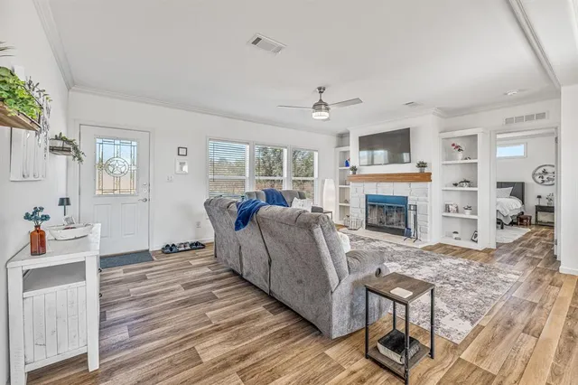 a living room with furniture and a fireplace