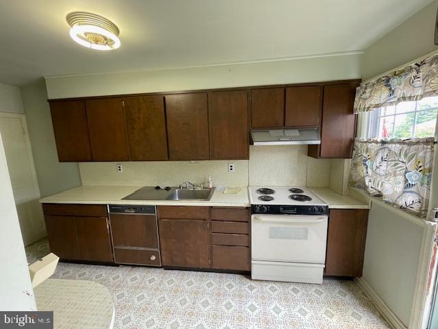 7228 Lanark Road Baltimore, MD 21212 - Photo 4 of 16 a kitchen with stainless steel appliances granite countertop a sink stove and refrigerator