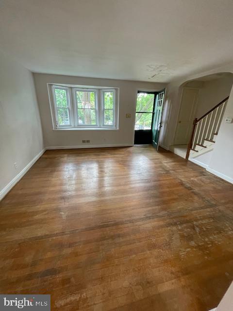 7228 Lanark Road Baltimore, MD 21212 - Photo 5 of 16 wooden floor in an empty room with a window