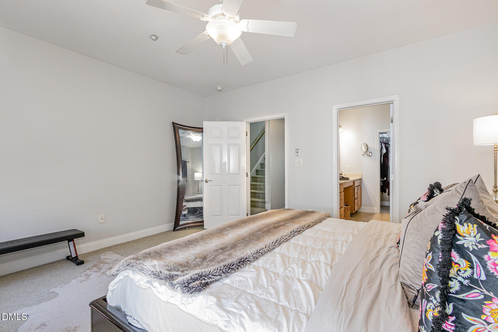 9211 Calabria Drive, Unit 117 Raleigh, NC 27617 - Photo 6 of 19 a bedroom with a bed and a chandelier