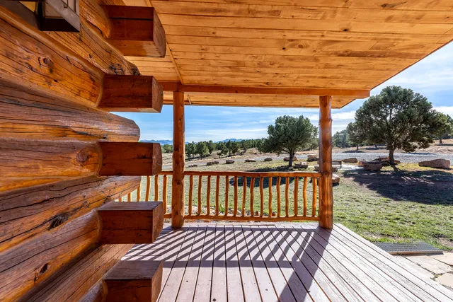a view of a patio with wooden floor