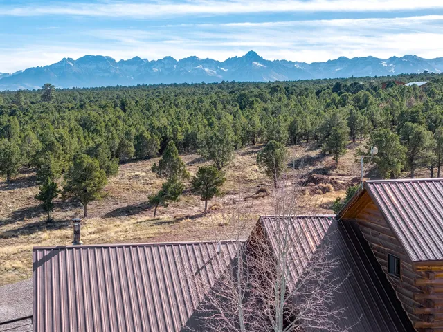 a terrace with outdoor seating and city view