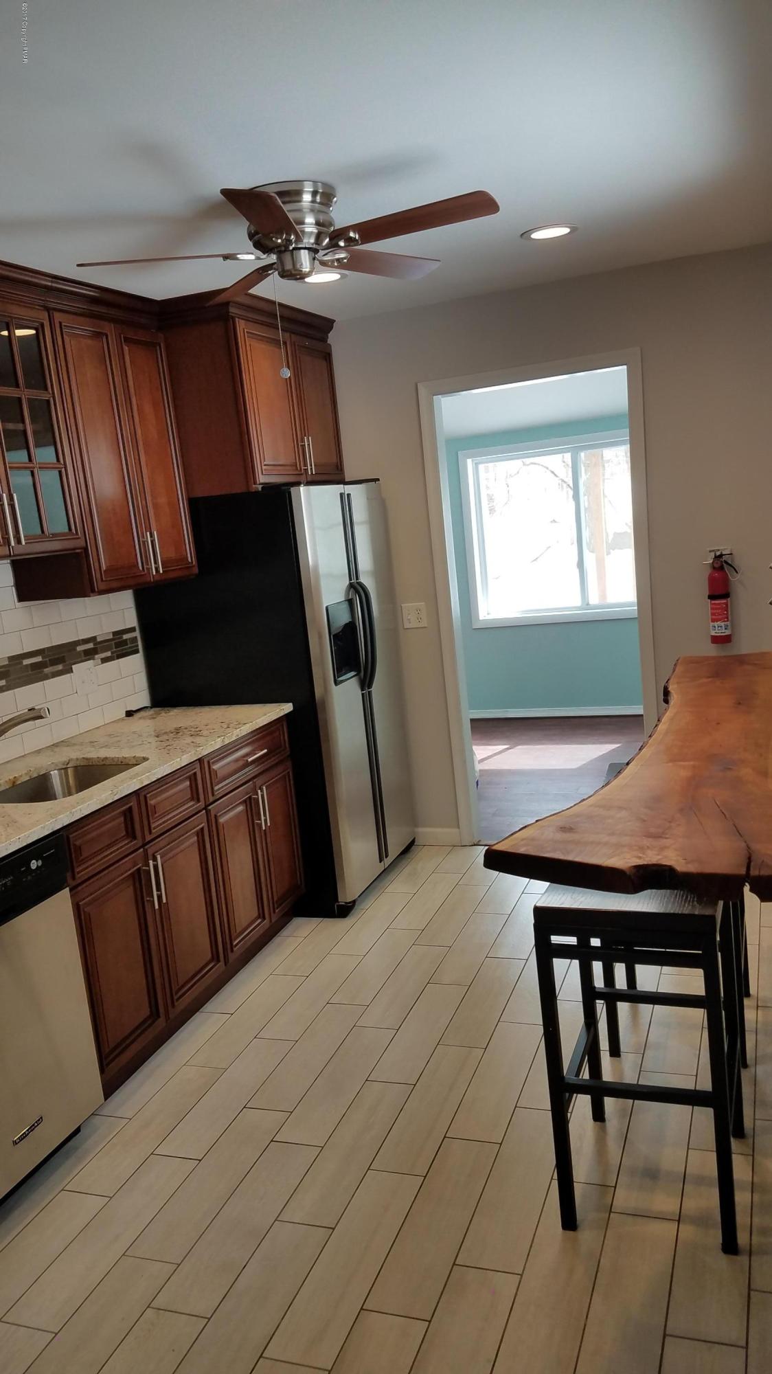 128 Selig Road Pocono Lake, PA 18347 - Photo 12 of 21 128 Selig Kitchen With Breakfast Bar