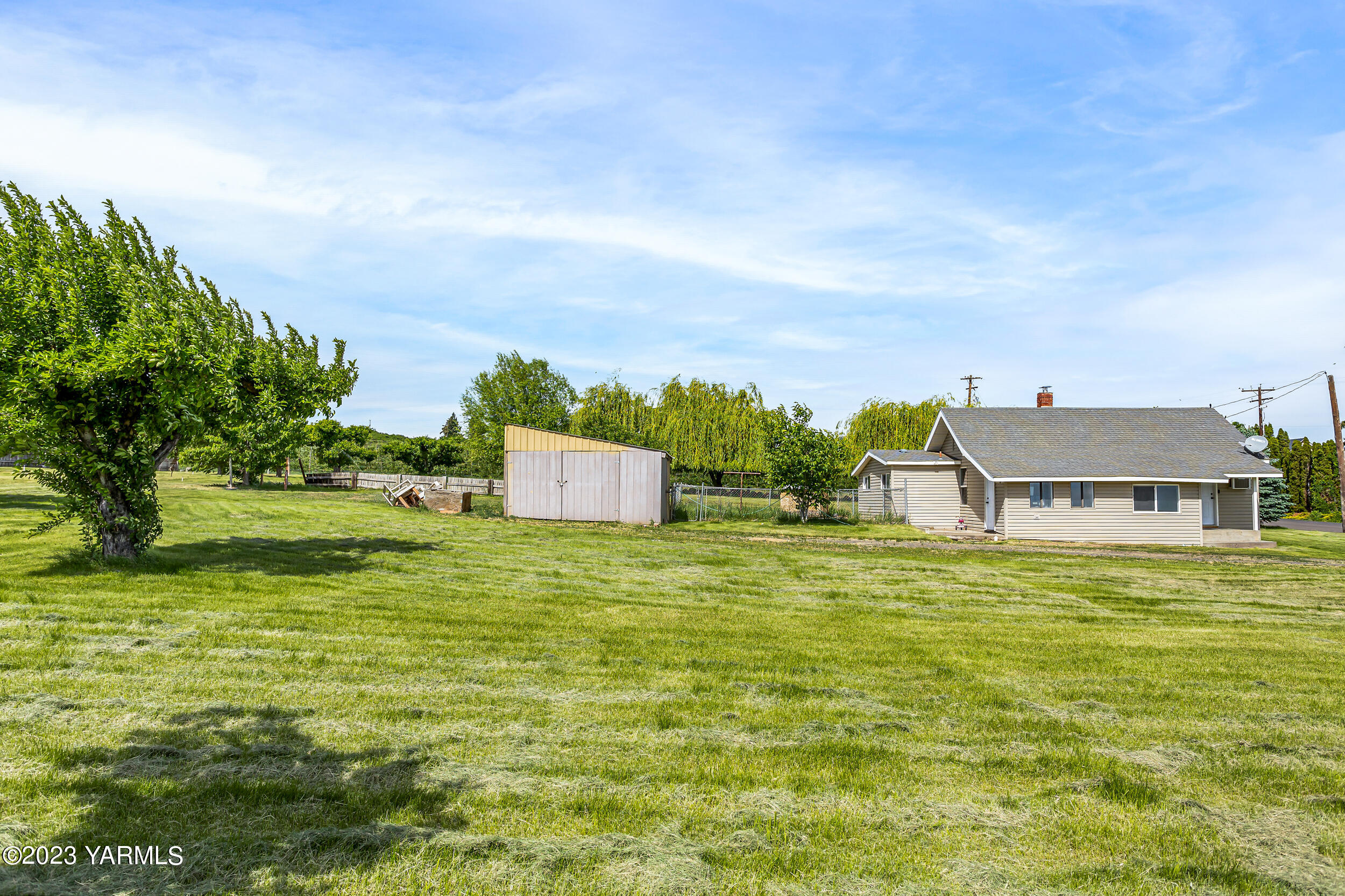 170 Sharp Road Tieton, WA 98947 - Photo 7 of 34 a house view with a garden space