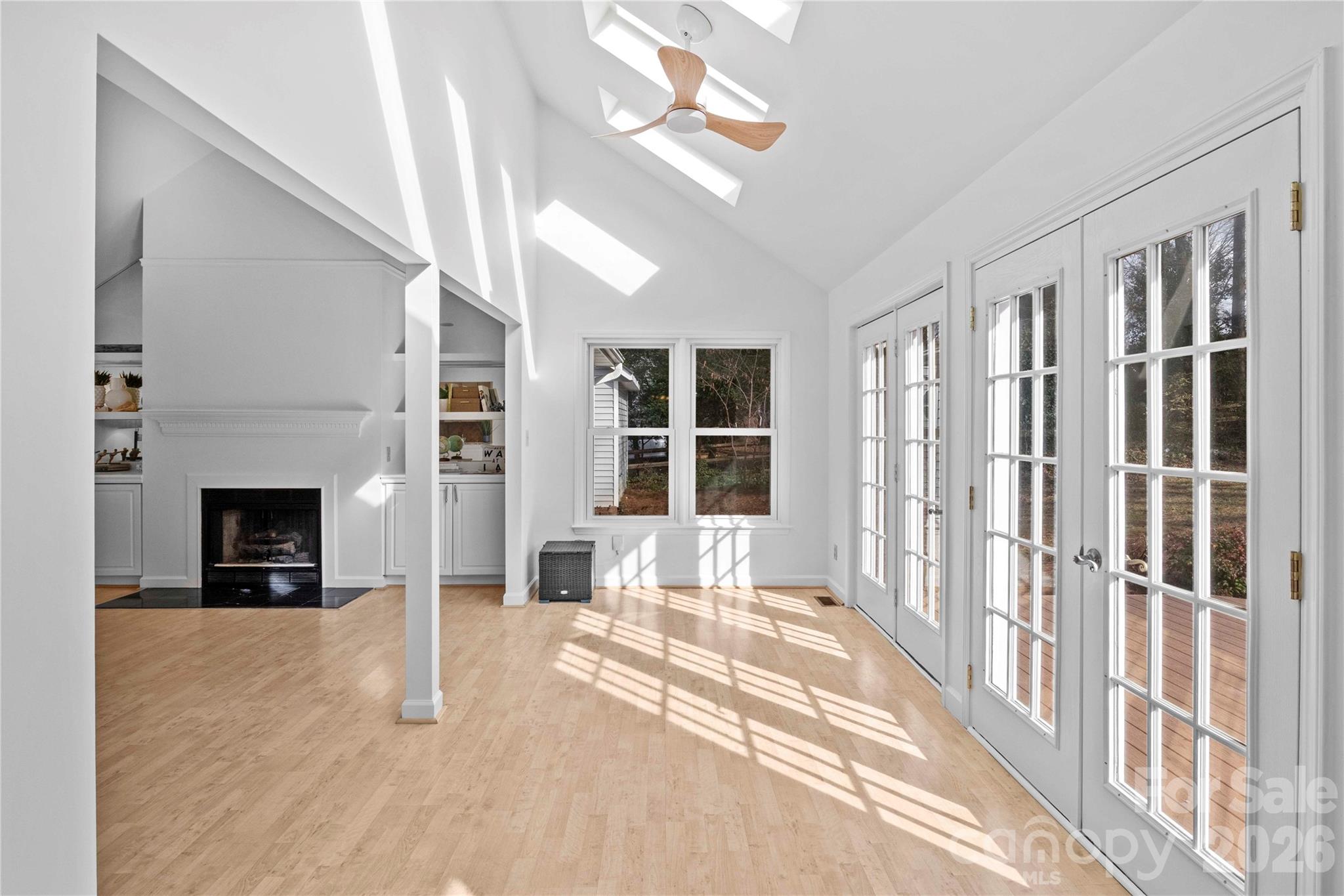 21133 Rio Oro Drive Cornelius, NC 28031 - Photo 11 of 41 a view of an empty room with a fireplace and a window