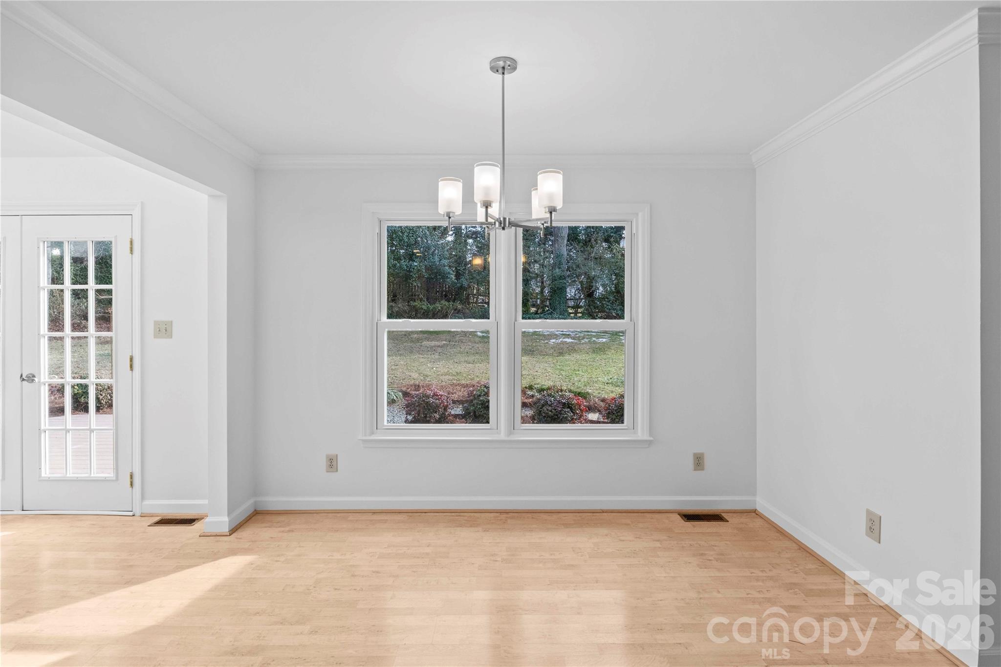 21133 Rio Oro Drive Cornelius, NC 28031 - Photo 13 of 41 an empty room with windows and outdoor space