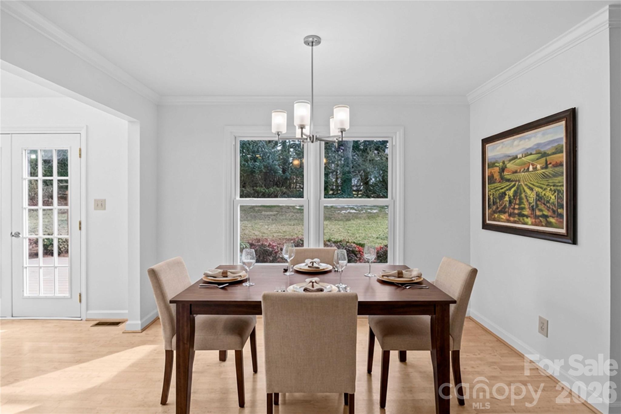 21133 Rio Oro Drive Cornelius, NC 28031 - Photo 14 of 41 a view of a dining room with furniture window and outside view