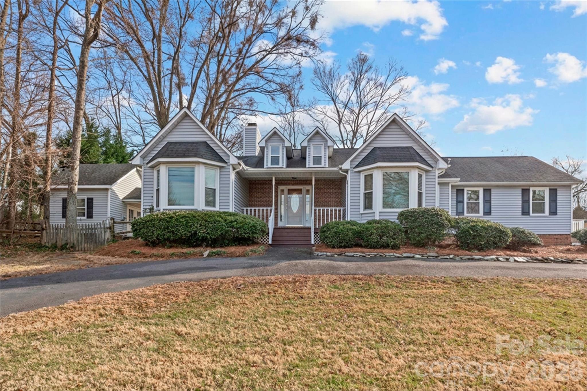 21133 Rio Oro Drive Cornelius, NC 28031 - Photo 2 of 41 a front view of a house with a yard
