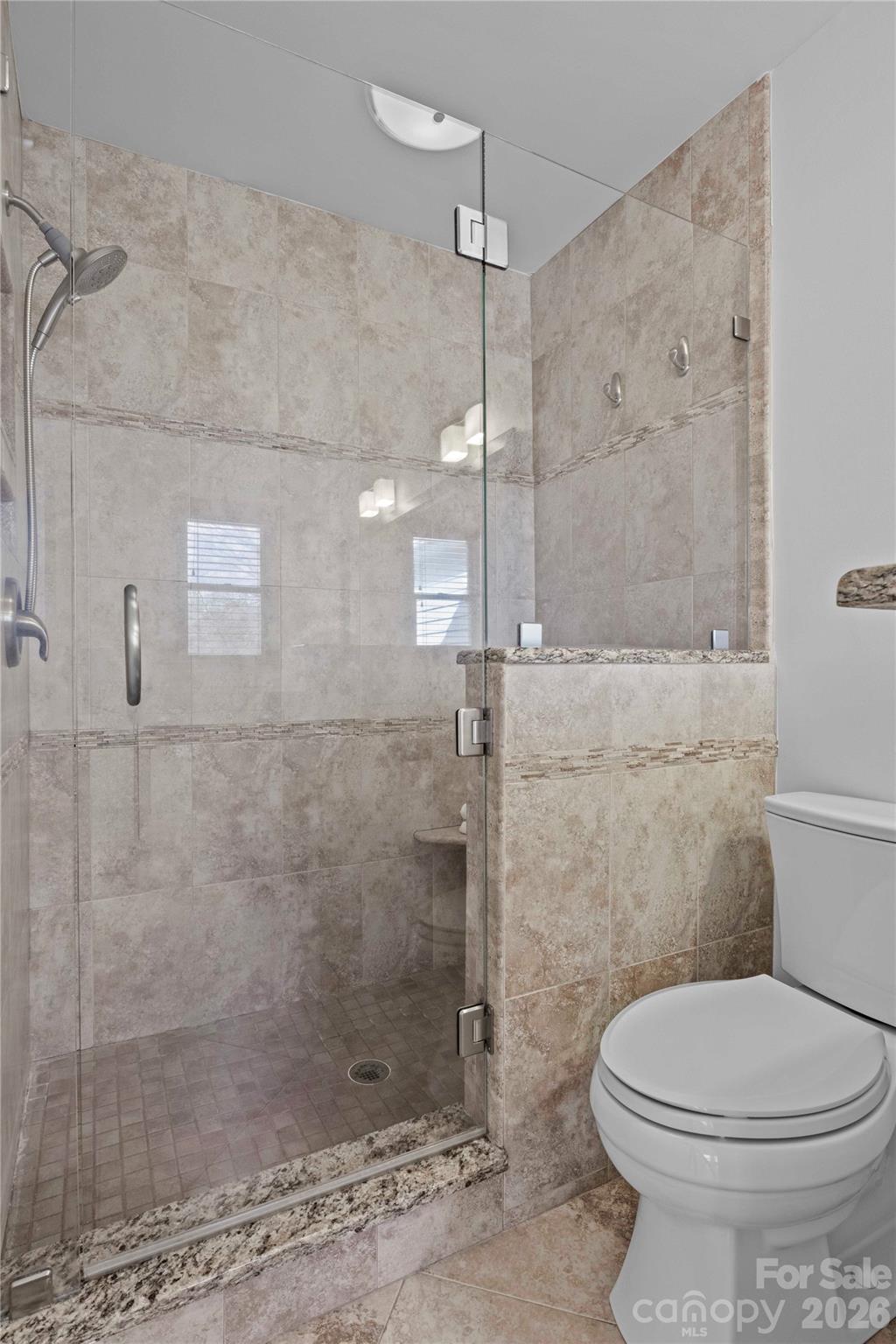21133 Rio Oro Drive Cornelius, NC 28031 - Photo 22 of 41 a bathroom with a toilet and a shower