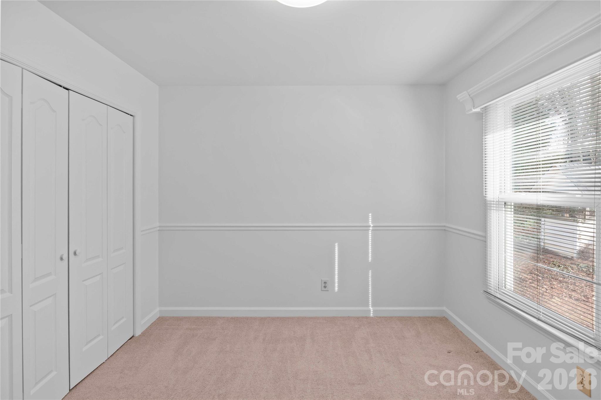 21133 Rio Oro Drive Cornelius, NC 28031 - Photo 25 of 41 a view of an empty room with a window
