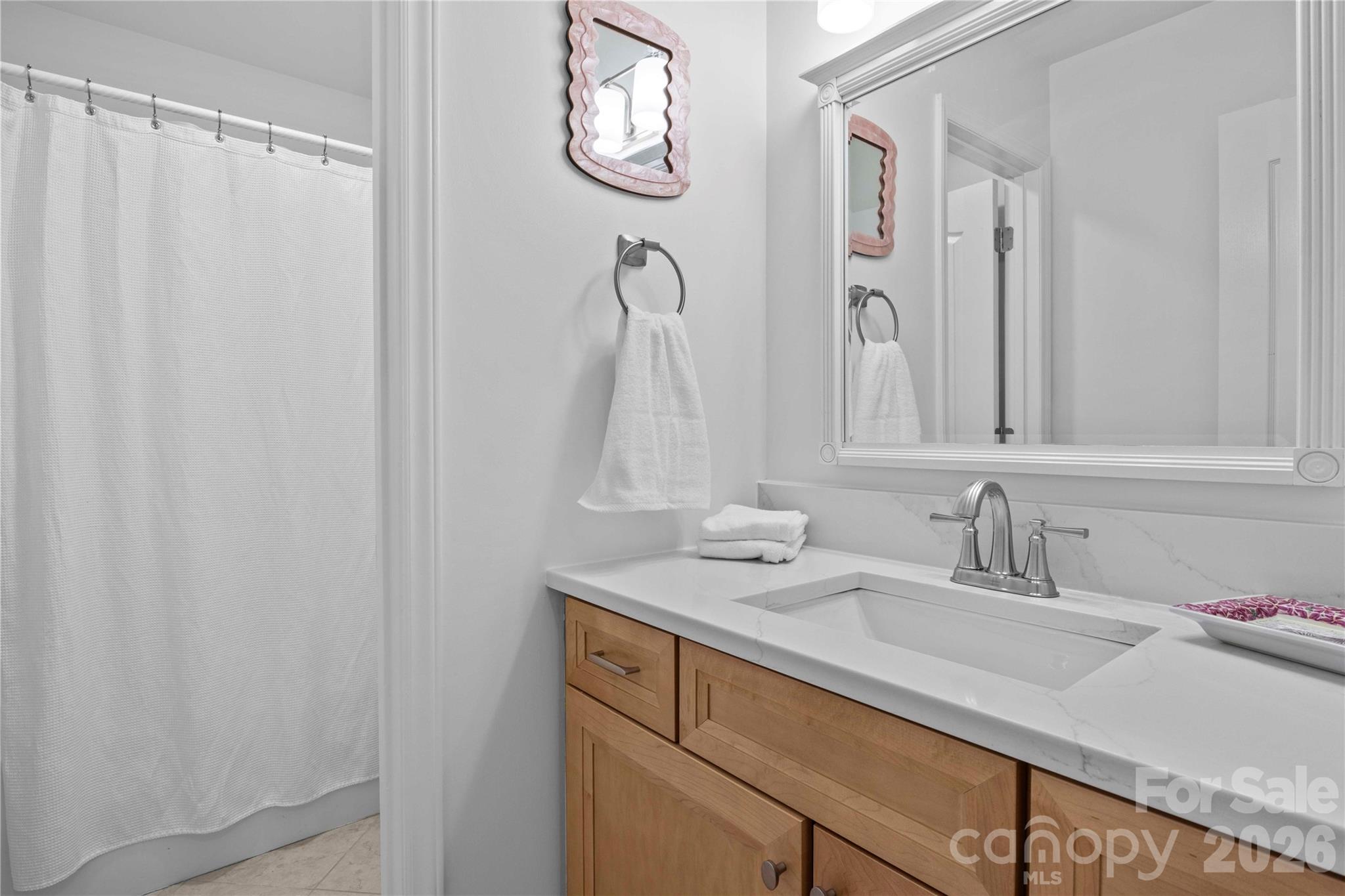 21133 Rio Oro Drive Cornelius, NC 28031 - Photo 27 of 41 a bathroom with a sink and a mirror