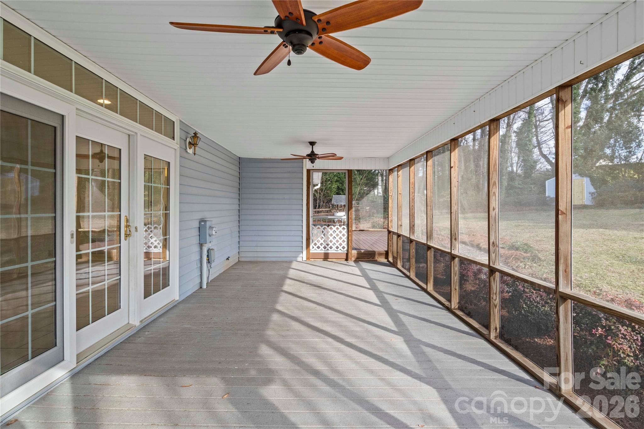 21133 Rio Oro Drive Cornelius, NC 28031 - Photo 28 of 41 a view of a porch with wooden floor and windows