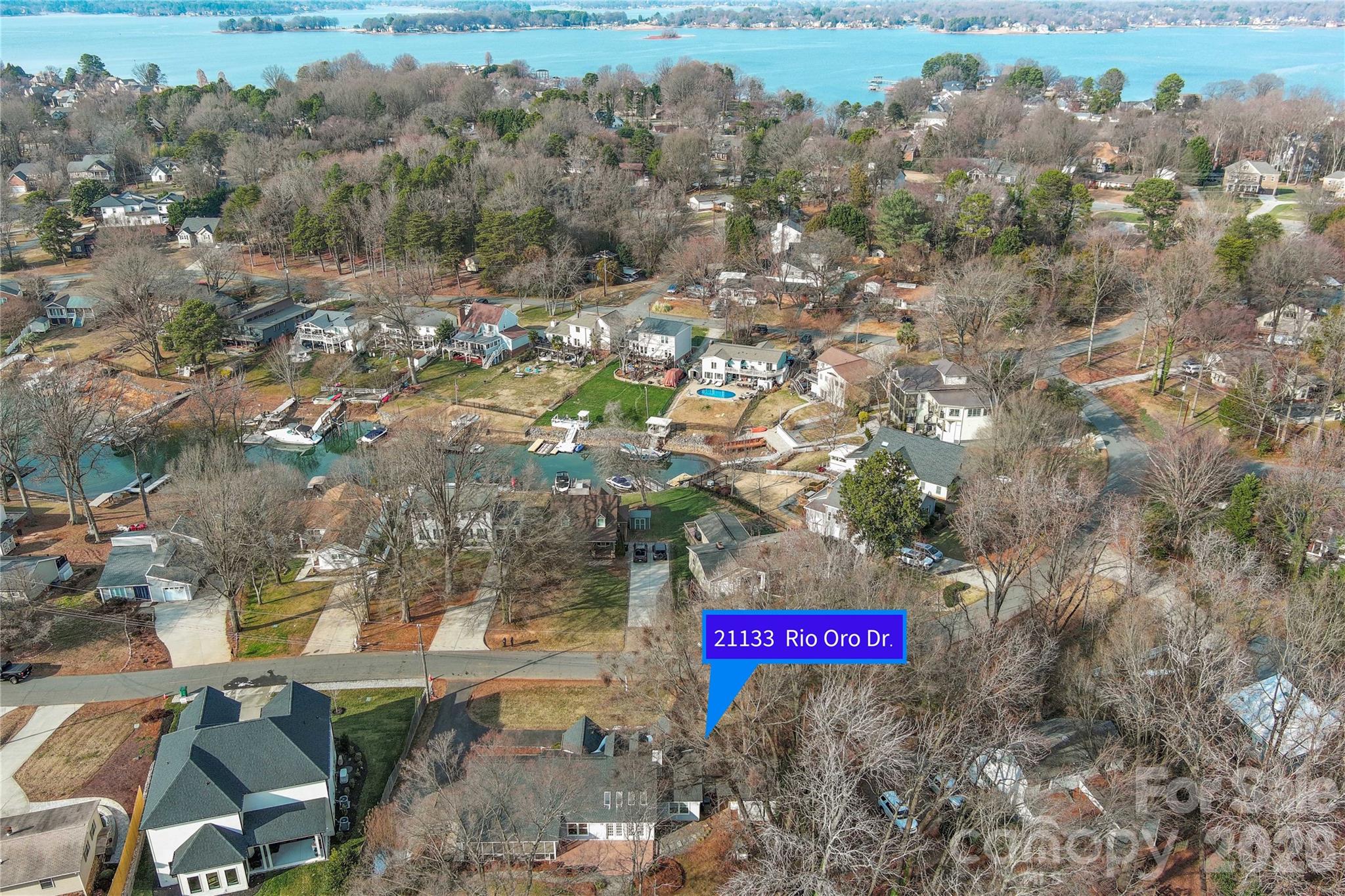 21133 Rio Oro Drive Cornelius, NC 28031 - Photo 3 of 41 a sign that is sitting on a road