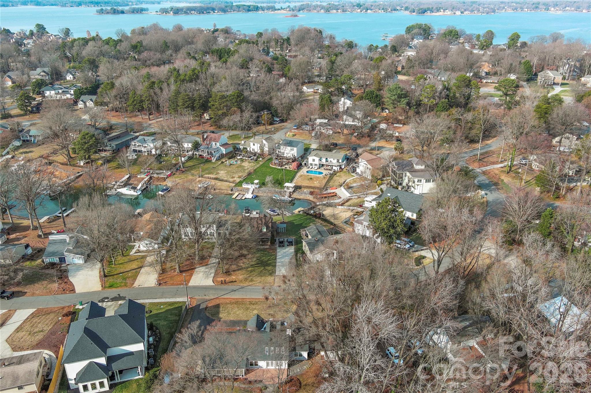 21133 Rio Oro Drive Cornelius, NC 28031 - Photo 4 of 41 an aerial view of residential houses with outdoor space and trees