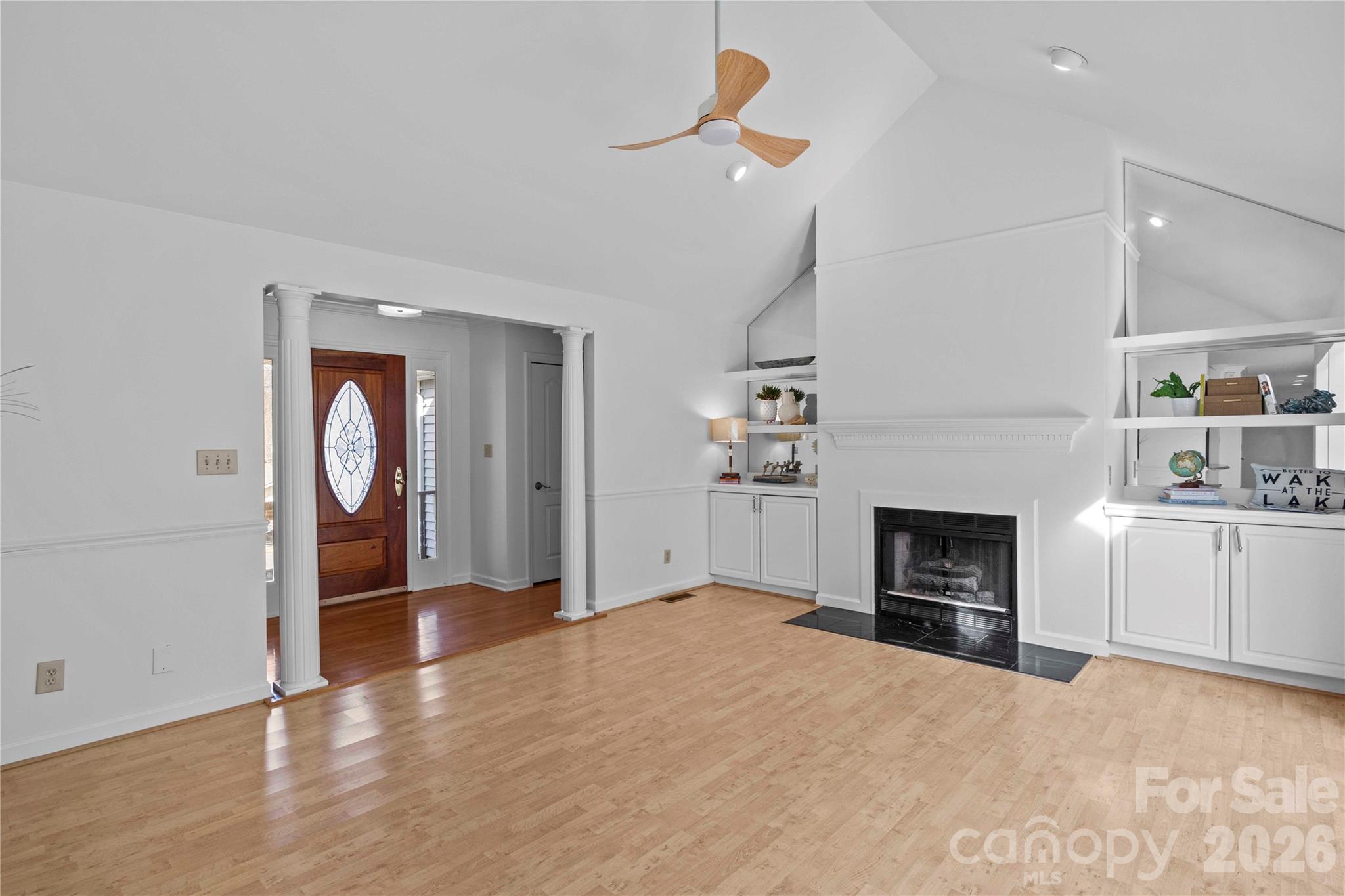 21133 Rio Oro Drive Cornelius, NC 28031 - Photo 8 of 41 a view of an empty room with a fireplace and a window