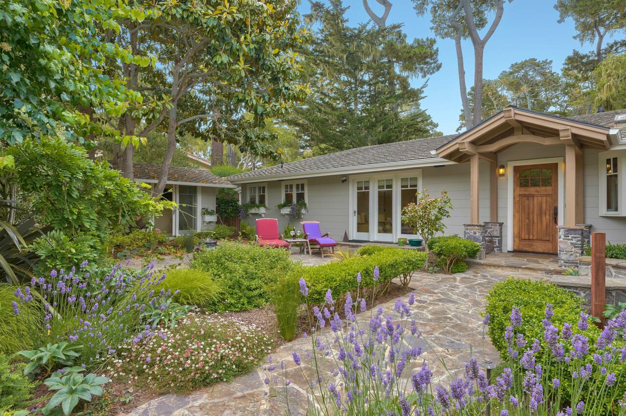 a front view of a house with garden
