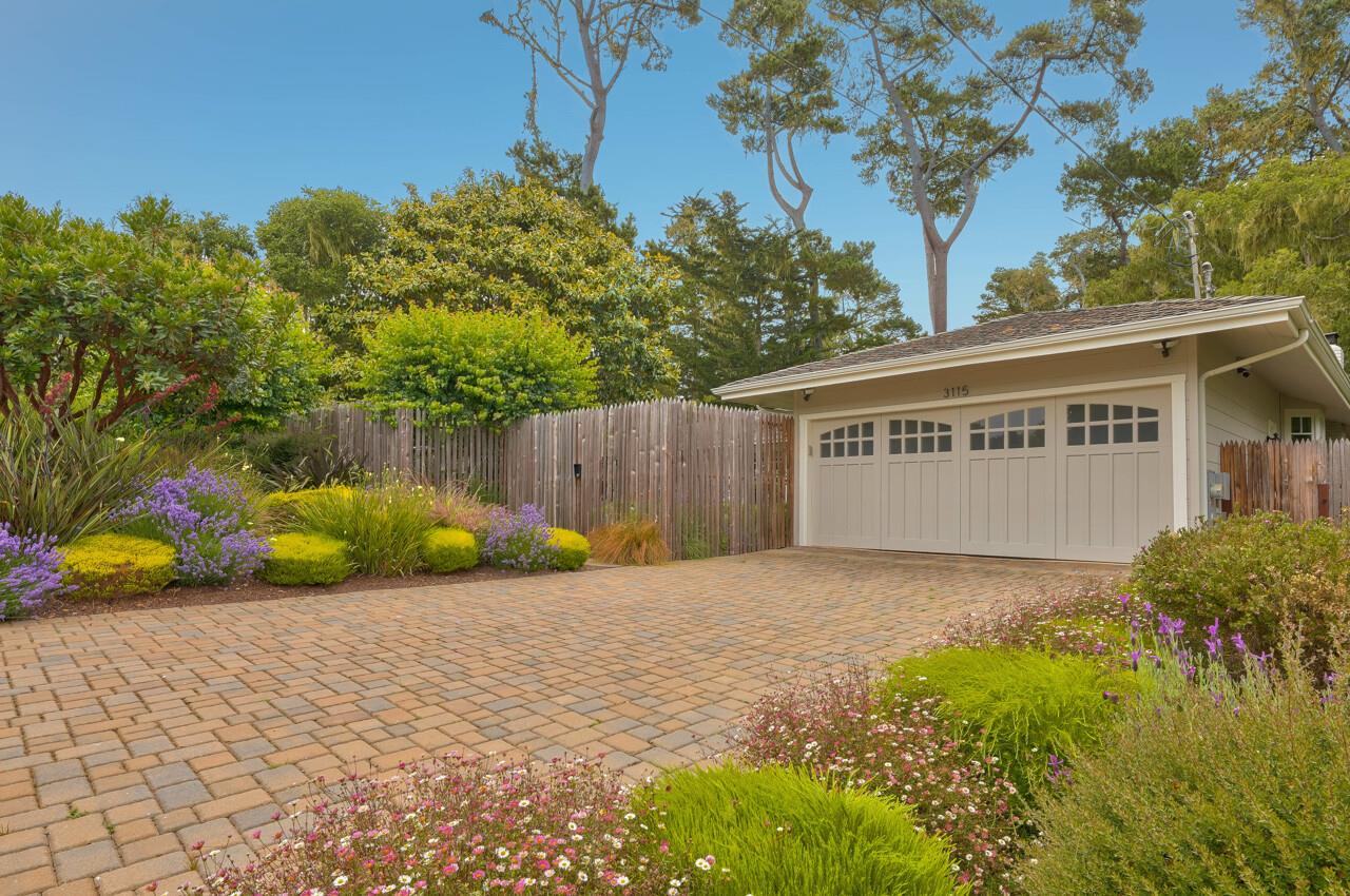 3115 Middle Ranch Road Pebble Beach, CA 93953 - Photo 15 of 15 a view of a house with a yard and potted plants
