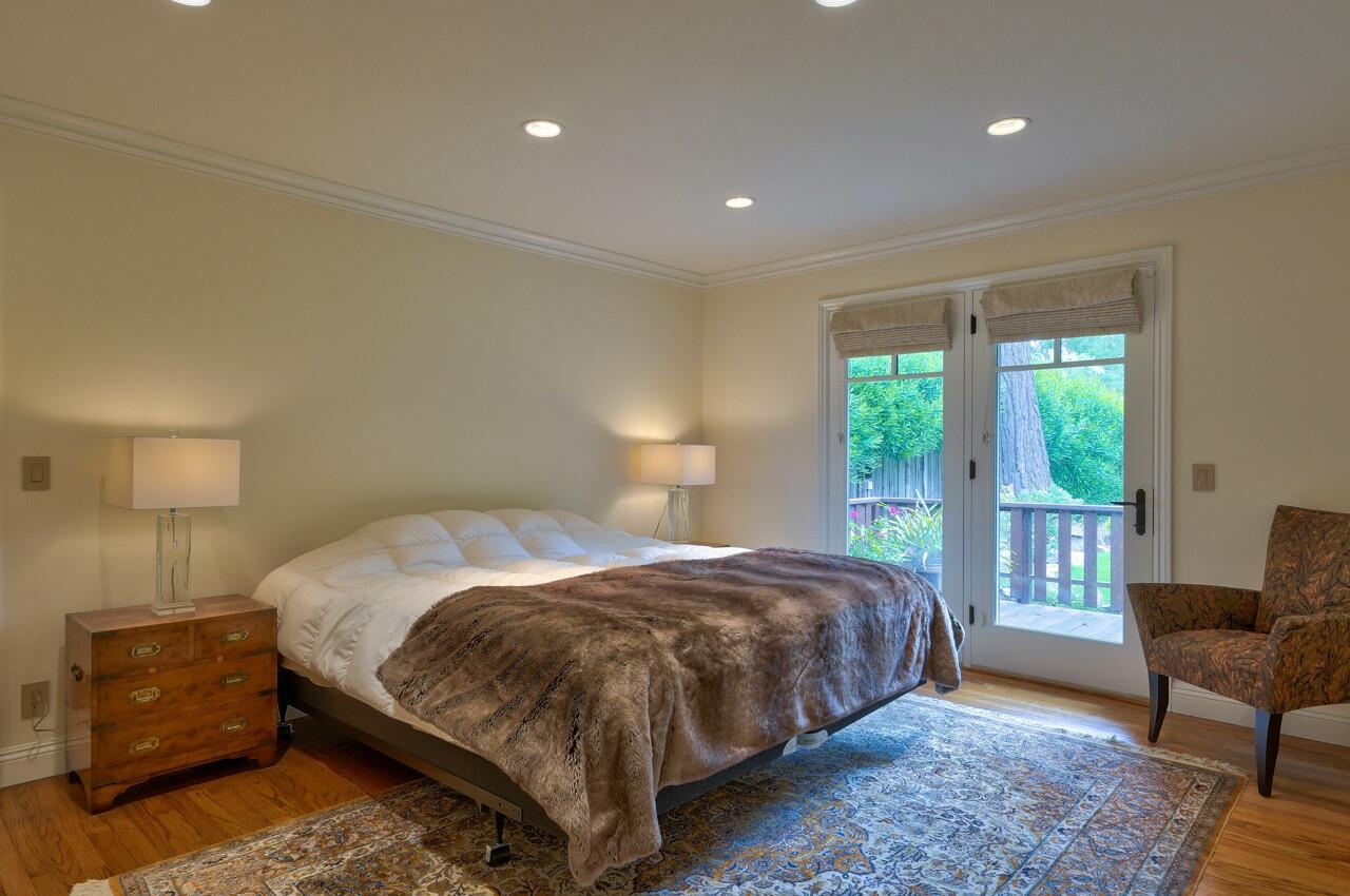 3115 Middle Ranch Road Pebble Beach, CA 93953 - Photo 8 of 15 a bedroom with a bed and a chair