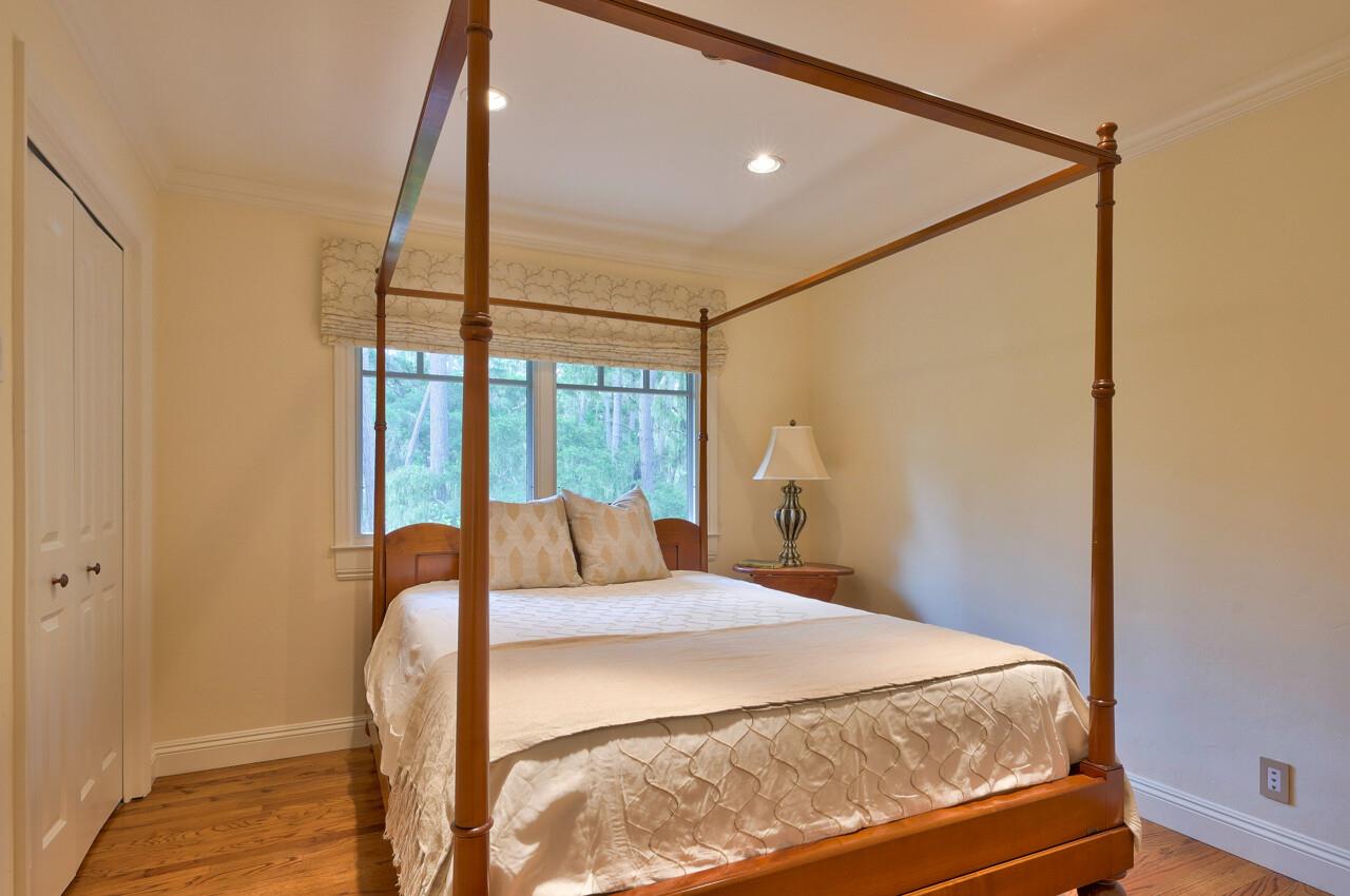 3115 Middle Ranch Road Pebble Beach, CA 93953 - Photo 10 of 15 a bedroom with a bed and a window