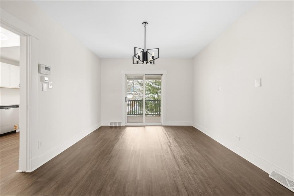 127 Duffland Street Pittsburgh, PA 15210 - Photo 12 of 36 wooden floor in an empty room with a window