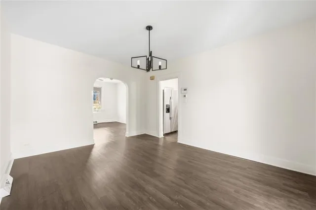 a kitchen with stainless steel appliances a stove microwave and sink