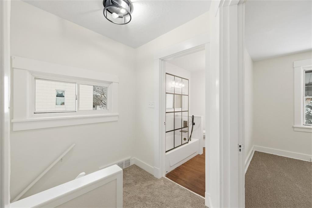 127 Duffland Street Pittsburgh, PA 15210 - Photo 19 of 36 a view of a livingroom with wooden floor and a window