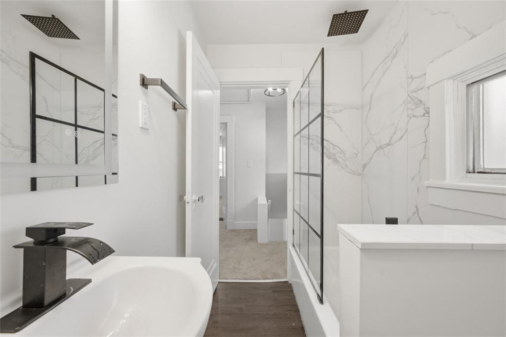 127 Duffland Street Pittsburgh, PA 15210 - Photo 21 of 36 a bathroom with a sink a toilet and shower