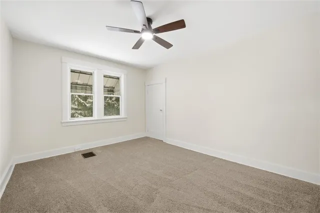 a view of a ceiling fan with wooden floor