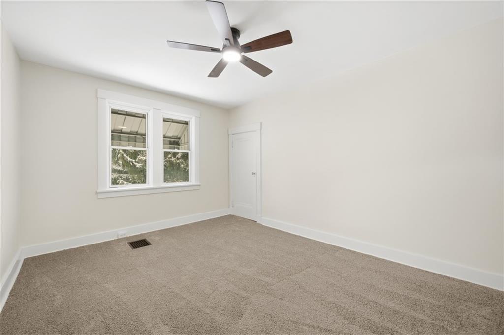 127 Duffland Street Pittsburgh, PA 15210 - Photo 22 of 36 an empty room with a window and a fan