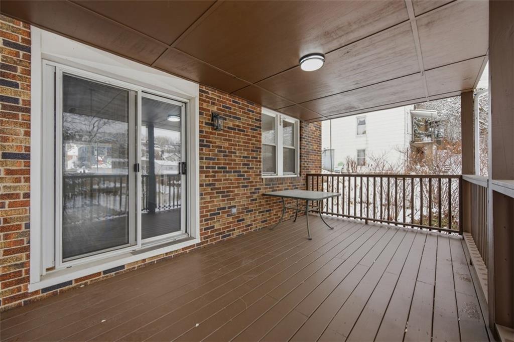 127 Duffland Street Pittsburgh, PA 15210 - Photo 33 of 36 a view of porch with a floor to ceiling window with wooden floor