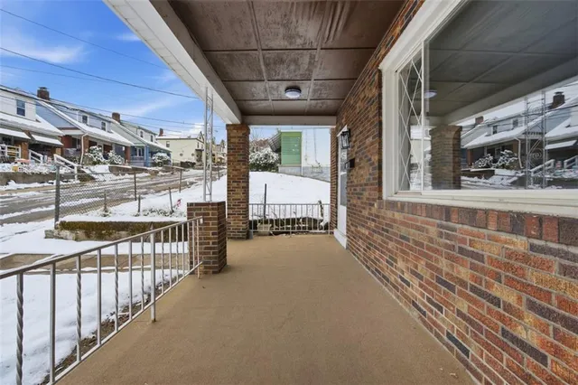a view of a porch with wooden floor