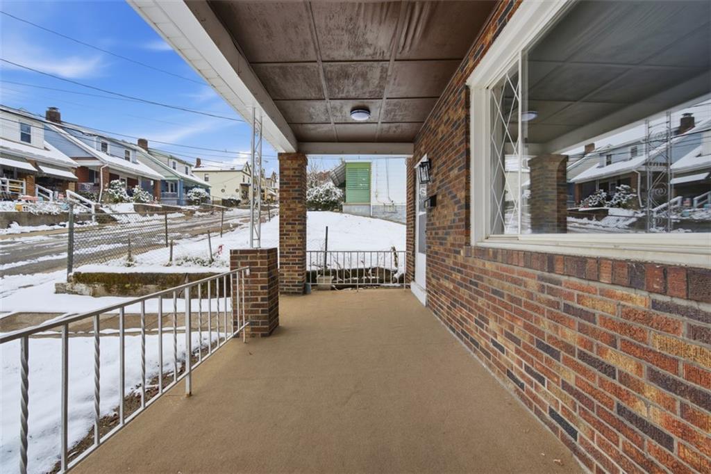 127 Duffland Street Pittsburgh, PA 15210 - Photo 4 of 36 a view of a porch with wooden floor