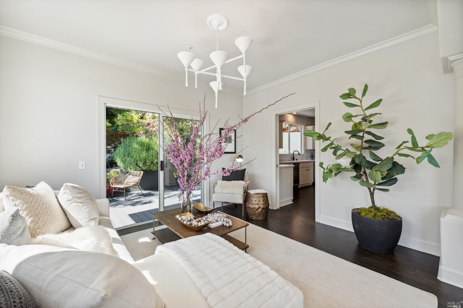 2 Spring Hill Circle Sausalito, CA 94965 - Photo 15 of 57 a living room with furniture a chandelier and a potted plant