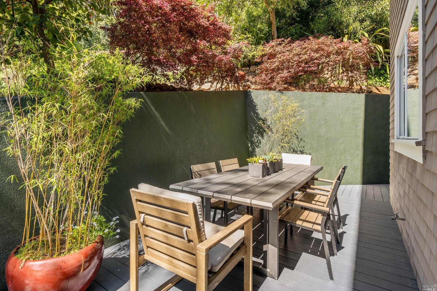 2 Spring Hill Circle Sausalito, CA 94965 - Photo 19 of 57 a view of a patio with table and chairs with wooden floor and fence