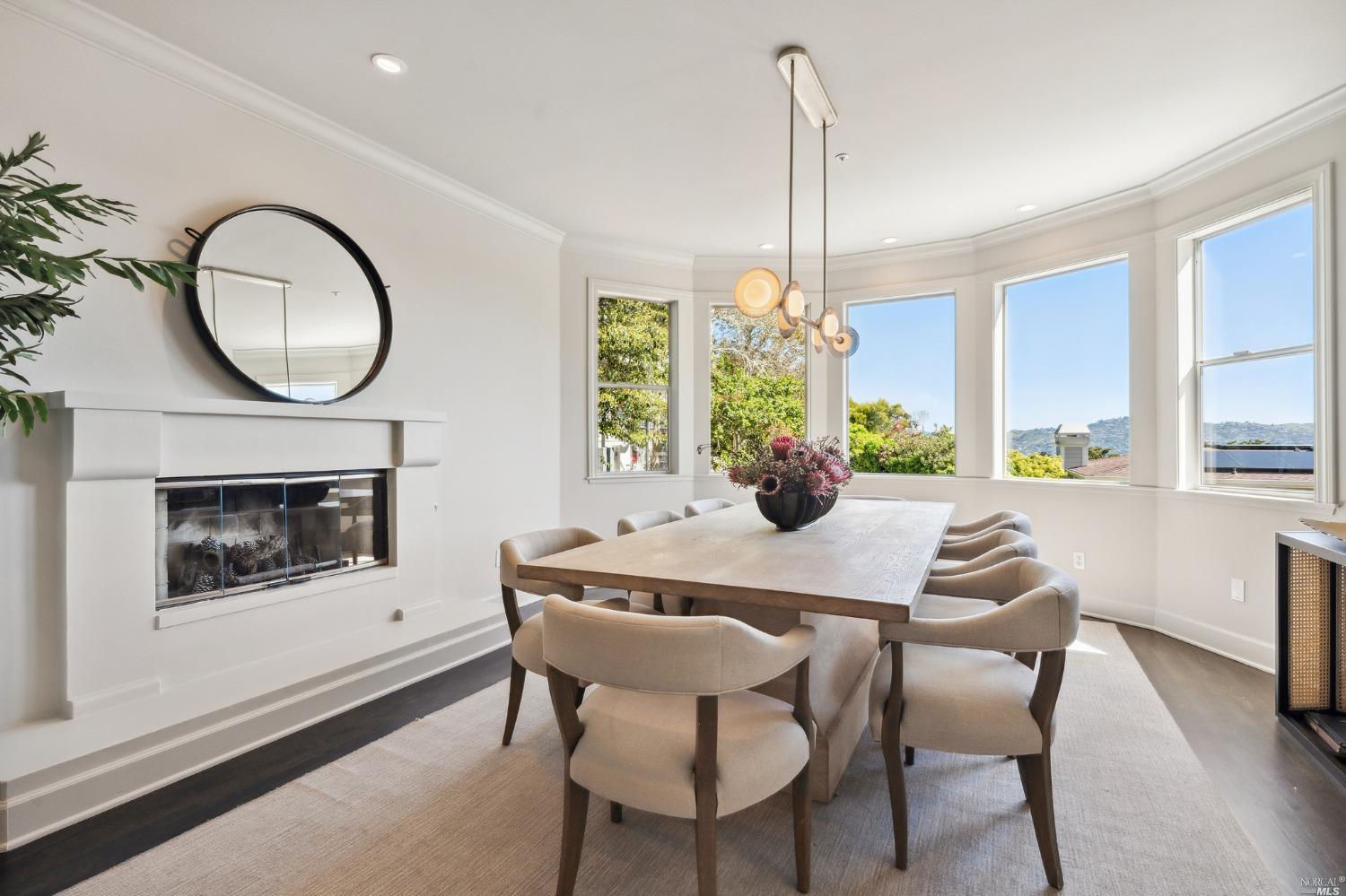 2 Spring Hill Circle Sausalito, CA 94965 - Photo 27 of 57 a dining room with furniture a chandelier and wooden floor