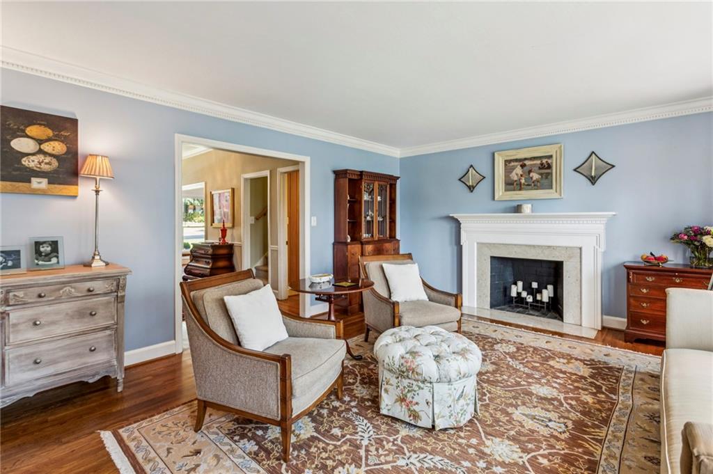 3384 Pine Meadow Road Northwest Atlanta, GA 30327 - Photo 11 of 56 a living room with furniture and a fireplace